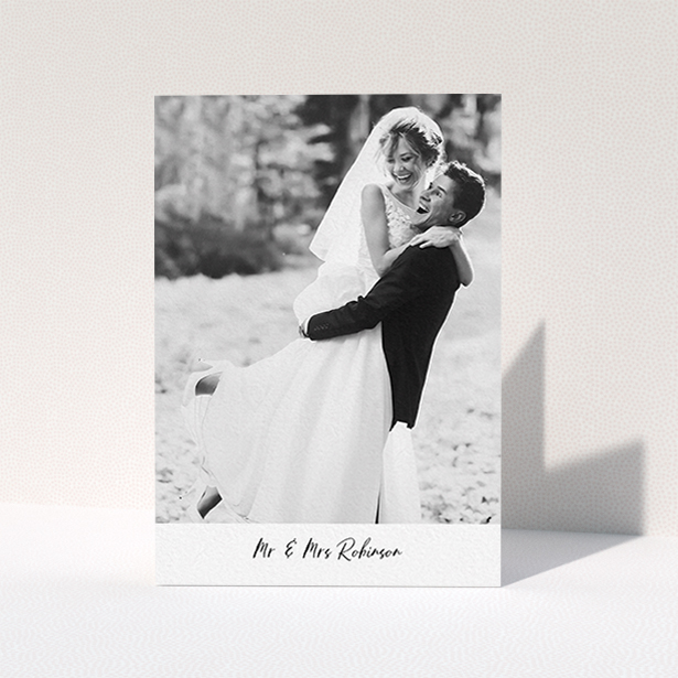 A wedding thank you card design called "Mr & Mrs Footer". It is an A6 card in a portrait orientation. It is a photographic wedding thank you card with room for 1 photo. "Mr & Mrs Footer" is available as a folded card, with mainly white colouring.