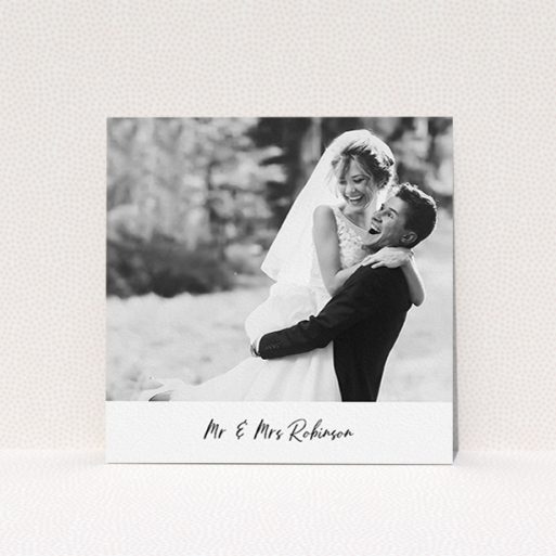 A wedding thank you card template titled "Mr & Mrs Footer". It is a square (148mm x 148mm) card in a square orientation. It is a photographic wedding thank you card with room for 1 photo. "Mr & Mrs Footer" is available as a flat card, with mainly white colouring.