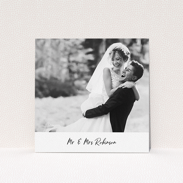 A wedding thank you card template titled "Mr & Mrs Footer". It is a square (148mm x 148mm) card in a square orientation. It is a photographic wedding thank you card with room for 1 photo. "Mr & Mrs Footer" is available as a flat card, with mainly white colouring.