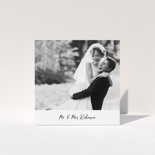 A wedding thank you card design called "Mr & Mrs Footer". It is a square (148mm x 148mm) card in a square orientation. It is a photographic wedding thank you card with room for 1 photo. "Mr & Mrs Footer" is available as a folded card, with mainly white colouring.