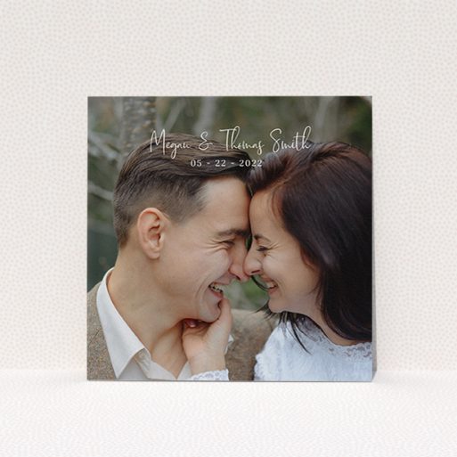 A wedding thank you card design called "Name-Date-Photo". It is a square (148mm x 148mm) card in a square orientation. It is a photographic wedding thank you card with room for 1 photo. "Name-Date-Photo" is available as a flat card, with mainly white colouring.