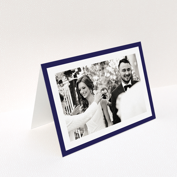 A wedding thank you card named "Navy Border". It is an A5 card in a landscape orientation. It is a photographic wedding thank you card with room for 1 photo. "Navy Border" is available as a folded card, with tones of blue and white.