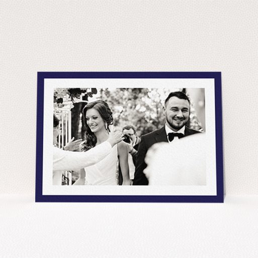 A wedding thank you card design named "Navy Border". It is an A6 card in a landscape orientation. It is a photographic wedding thank you card with room for 1 photo. "Navy Border" is available as a flat card, with tones of blue and white.