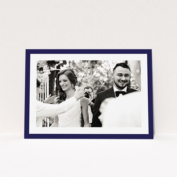 A wedding thank you card design named "Navy Border". It is an A6 card in a landscape orientation. It is a photographic wedding thank you card with room for 1 photo. "Navy Border" is available as a flat card, with tones of blue and white.