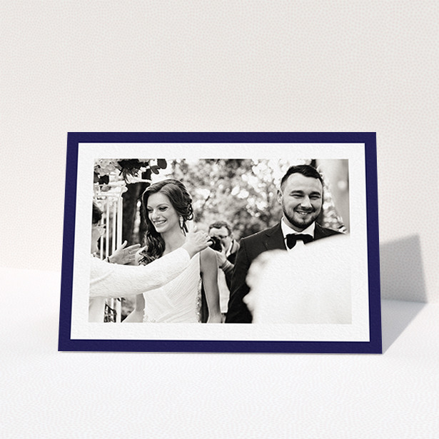 A wedding thank you card called "Navy Border". It is an A6 card in a landscape orientation. It is a photographic wedding thank you card with room for 1 photo. "Navy Border" is available as a folded card, with tones of blue and white.