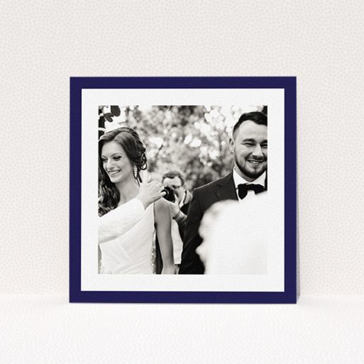 A wedding thank you card called "Navy Border". It is a square (148mm x 148mm) card in a square orientation. It is a photographic wedding thank you card with room for 1 photo. "Navy Border" is available as a flat card, with tones of blue and white.