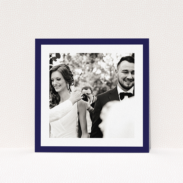 A wedding thank you card called "Navy Border". It is a square (148mm x 148mm) card in a square orientation. It is a photographic wedding thank you card with room for 1 photo. "Navy Border" is available as a flat card, with tones of blue and white.
