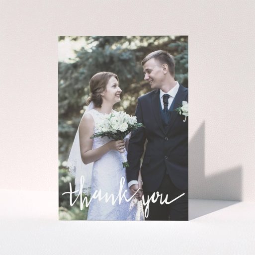A wedding thank you card called "New to calligraphy". It is an A5 card in a portrait orientation. It is a photographic wedding thank you card with room for 1 photo. "New to calligraphy" is available as a folded card, with mainly white colouring.