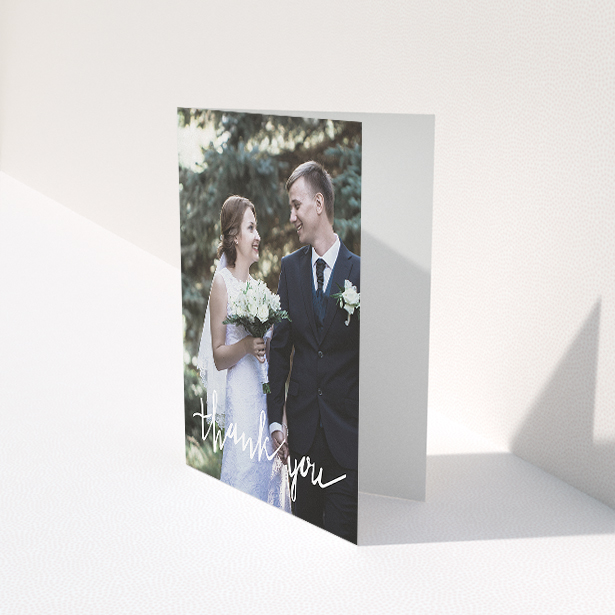 A wedding thank you card called "New to calligraphy". It is an A5 card in a portrait orientation. It is a photographic wedding thank you card with room for 1 photo. "New to calligraphy" is available as a folded card, with mainly white colouring.