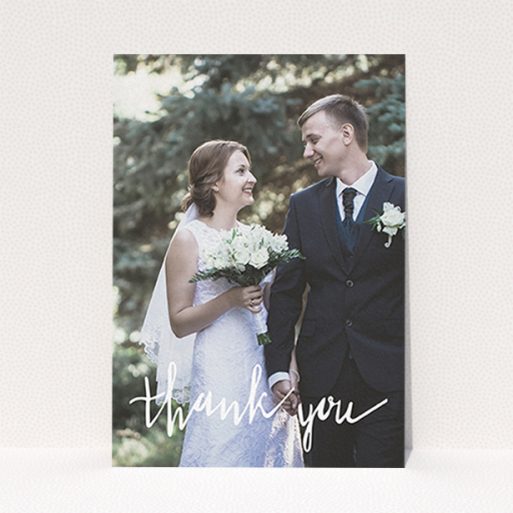 A wedding thank you card called "New to calligraphy". It is an A6 card in a portrait orientation. It is a photographic wedding thank you card with room for 1 photo. "New to calligraphy" is available as a flat card, with mainly white colouring.