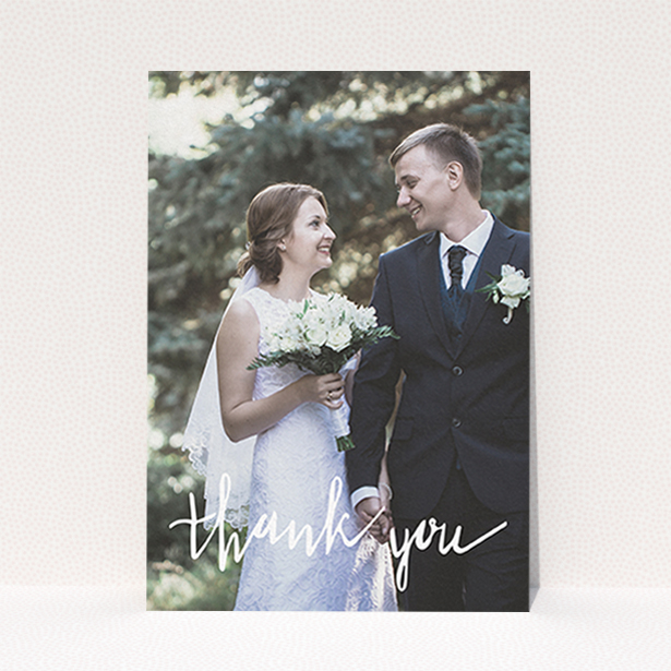 A wedding thank you card called "New to calligraphy". It is an A6 card in a portrait orientation. It is a photographic wedding thank you card with room for 1 photo. "New to calligraphy" is available as a flat card, with mainly white colouring.