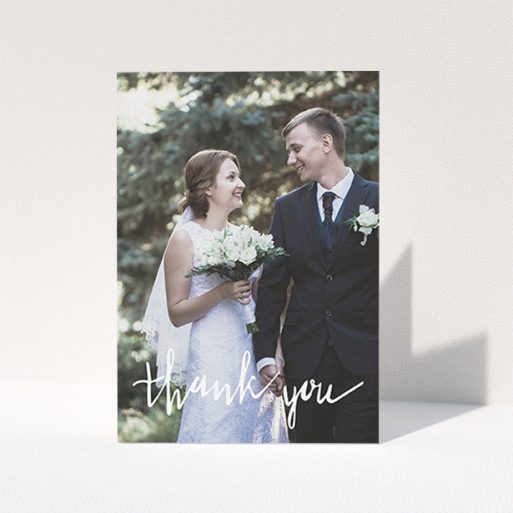 A wedding thank you card template titled "New to calligraphy". It is an A6 card in a portrait orientation. It is a photographic wedding thank you card with room for 1 photo. "New to calligraphy" is available as a folded card, with mainly white colouring.