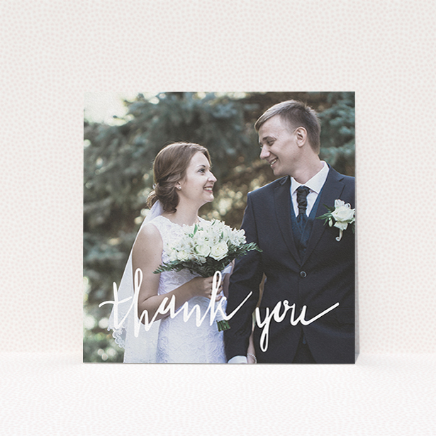 A wedding thank you card template titled "New to calligraphy". It is a square (148mm x 148mm) card in a square orientation. It is a photographic wedding thank you card with room for 1 photo. "New to calligraphy" is available as a flat card, with mainly white colouring.