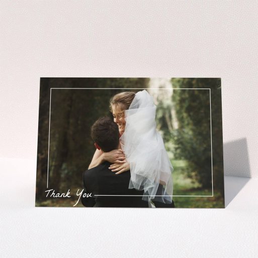 A wedding thank you card called "On Photo Border". It is an A5 card in a landscape orientation. It is a photographic wedding thank you card with room for 1 photo. "On Photo Border" is available as a folded card, with mainly white colouring.