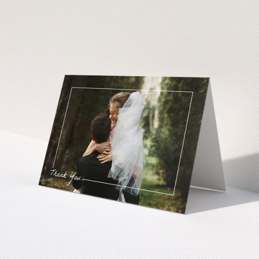 A wedding thank you card called 'On Photo Border'. It is an A5 card in a landscape orientation. It is a photographic wedding thank you card with room for 1 photo. 'On Photo Border' is available as a folded card, with mainly white colouring.