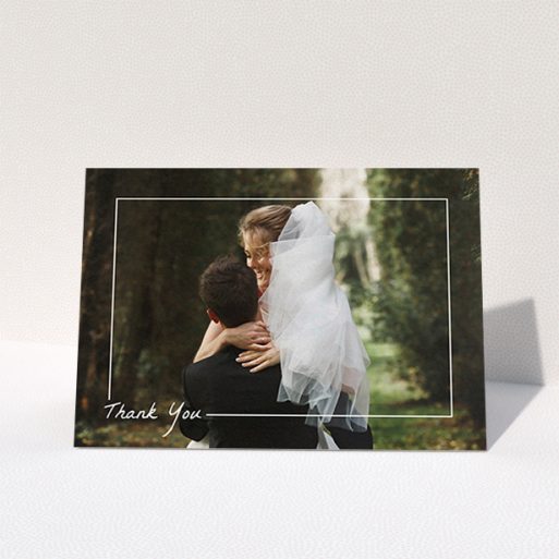 A wedding thank you card template titled "On Photo Border". It is an A6 card in a landscape orientation. It is a photographic wedding thank you card with room for 1 photo. "On Photo Border" is available as a folded card, with mainly white colouring.