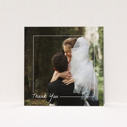 A wedding thank you card named "On Photo Border". It is a square (148mm x 148mm) card in a square orientation. It is a photographic wedding thank you card with room for 1 photo. "On Photo Border" is available as a flat card, with mainly white colouring.