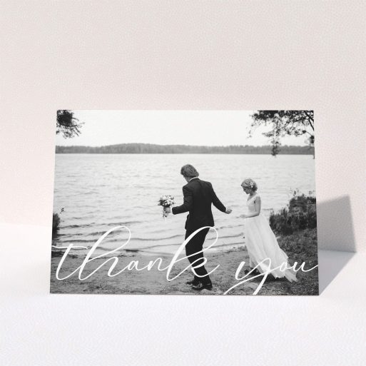 A wedding thank you card template titled "One Photo". It is an A5 card in a landscape orientation. It is a photographic wedding thank you card with room for 1 photo. "One Photo" is available as a folded card, with mainly white colouring.