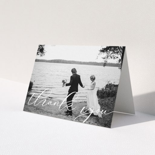 A wedding thank you card template titled 'One Photo'. It is an A5 card in a landscape orientation. It is a photographic wedding thank you card with room for 1 photo. 'One Photo' is available as a folded card, with mainly white colouring.