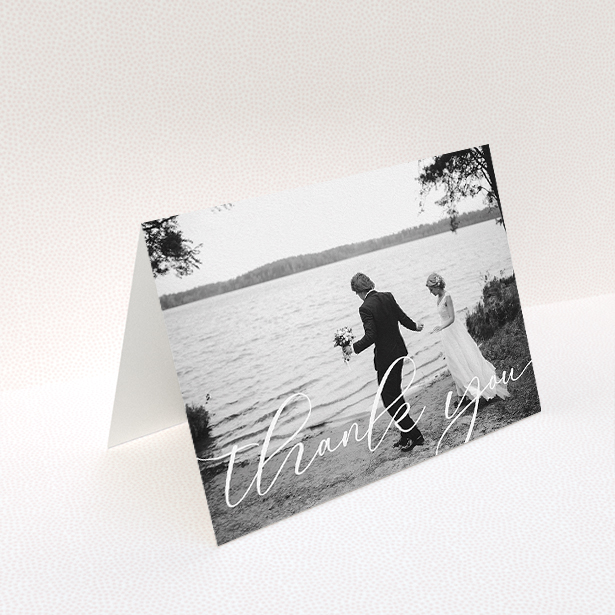 A wedding thank you card template titled "One Photo". It is an A5 card in a landscape orientation. It is a photographic wedding thank you card with room for 1 photo. "One Photo" is available as a folded card, with mainly white colouring.