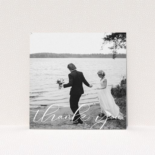 A wedding thank you card design named "One Photo". It is a square (148mm x 148mm) card in a square orientation. It is a photographic wedding thank you card with room for 1 photo. "One Photo" is available as a flat card, with mainly white colouring.