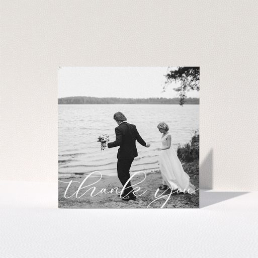 A wedding thank you card design titled "One Photo". It is a square (148mm x 148mm) card in a square orientation. It is a photographic wedding thank you card with room for 1 photo. "One Photo" is available as a folded card, with mainly white colouring.