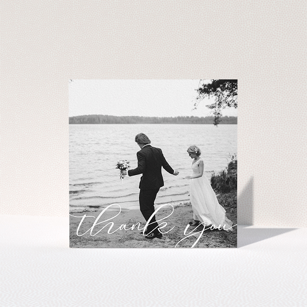 A wedding thank you card design titled "One Photo". It is a square (148mm x 148mm) card in a square orientation. It is a photographic wedding thank you card with room for 1 photo. "One Photo" is available as a folded card, with mainly white colouring.