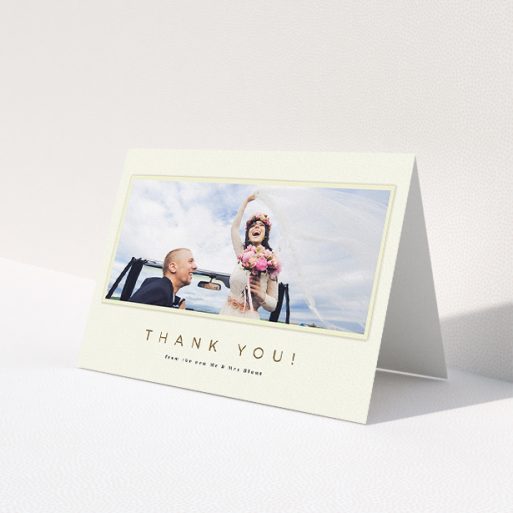 A wedding thank you card called 'One white Polaroid '. It is an A5 card in a landscape orientation. It is a photographic wedding thank you card with room for 1 photo. 'One white Polaroid ' is available as a folded card, with mainly cream colouring.