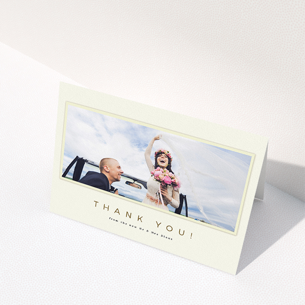 A wedding thank you card called "One white Polaroid ". It is an A5 card in a landscape orientation. It is a photographic wedding thank you card with room for 1 photo. "One white Polaroid " is available as a folded card, with mainly cream colouring.