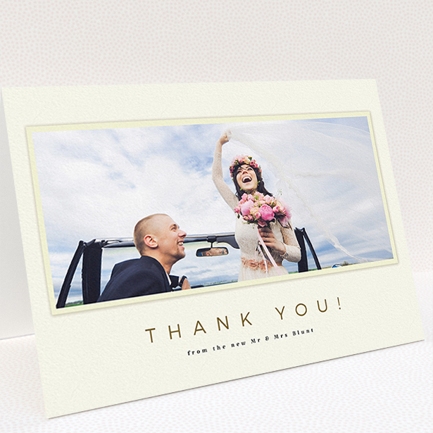 A wedding thank you card called "One white Polaroid ". It is an A5 card in a landscape orientation. It is a photographic wedding thank you card with room for 1 photo. "One white Polaroid " is available as a folded card, with mainly cream colouring.