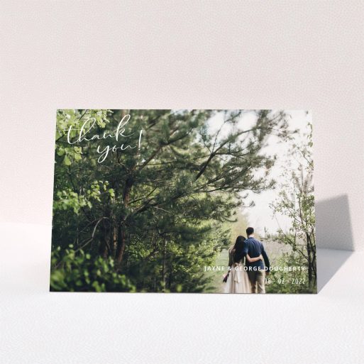 A wedding thank you card design called "Opposite Photo Corners". It is an A5 card in a landscape orientation. It is a photographic wedding thank you card with room for 1 photo. "Opposite Photo Corners" is available as a folded card, with mainly white colouring.