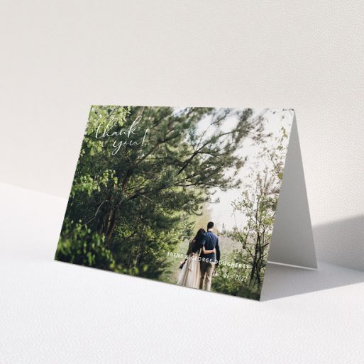 A wedding thank you card design called 'Opposite Photo Corners'. It is an A5 card in a landscape orientation. It is a photographic wedding thank you card with room for 1 photo. 'Opposite Photo Corners' is available as a folded card, with mainly white colouring.