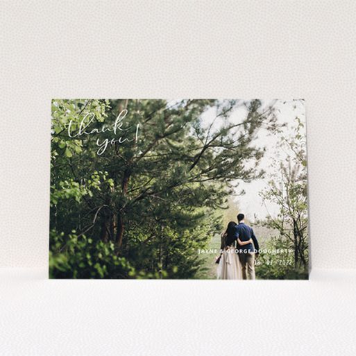 A wedding thank you card called "Opposite Photo Corners". It is an A6 card in a landscape orientation. It is a photographic wedding thank you card with room for 1 photo. "Opposite Photo Corners" is available as a flat card, with mainly white colouring.