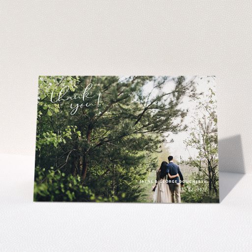 A wedding thank you card design titled "Opposite Photo Corners". It is an A6 card in a landscape orientation. It is a photographic wedding thank you card with room for 1 photo. "Opposite Photo Corners" is available as a folded card, with mainly white colouring.