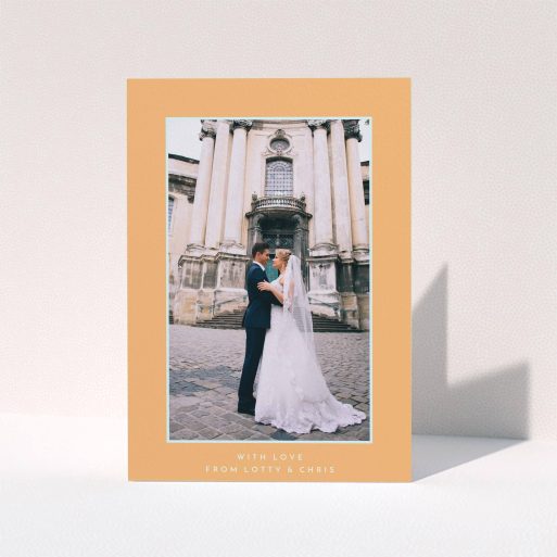 A wedding thank you card design called "Orange and blue". It is an A5 card in a portrait orientation. It is a photographic wedding thank you card with room for 1 photo. "Orange and blue" is available as a folded card, with tones of orange and blue.