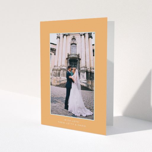 A wedding thank you card design called 'Orange and blue'. It is an A5 card in a portrait orientation. It is a photographic wedding thank you card with room for 1 photo. 'Orange and blue' is available as a folded card, with tones of orange and blue.