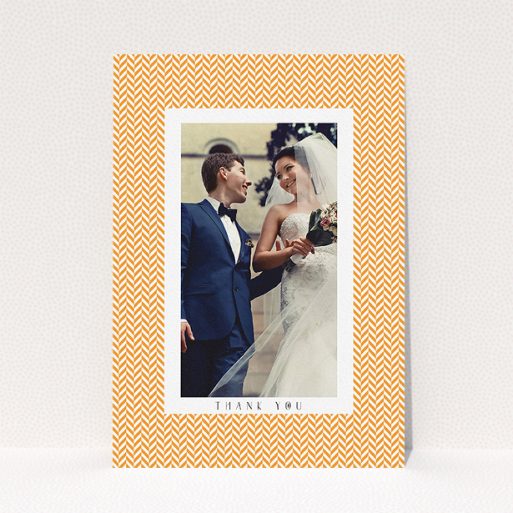 A wedding thank you card design titled "Orange Houndstooth". It is an A5 card in a portrait orientation. It is a photographic wedding thank you card with room for 1 photo. "Orange Houndstooth" is available as a flat card, with tones of orange and white.