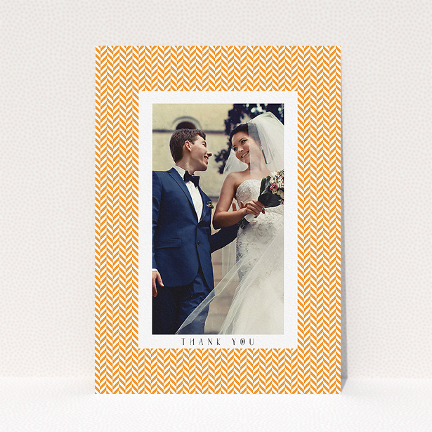 A wedding thank you card design titled "Orange Houndstooth". It is an A5 card in a portrait orientation. It is a photographic wedding thank you card with room for 1 photo. "Orange Houndstooth" is available as a flat card, with tones of orange and white.