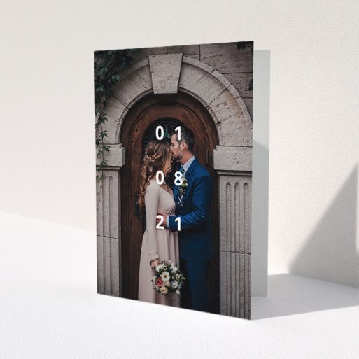 A wedding thank you card called 'Our Date'. It is an A5 card in a portrait orientation. It is a photographic wedding thank you card with room for 1 photo. 'Our Date' is available as a folded card, with mainly white colouring.