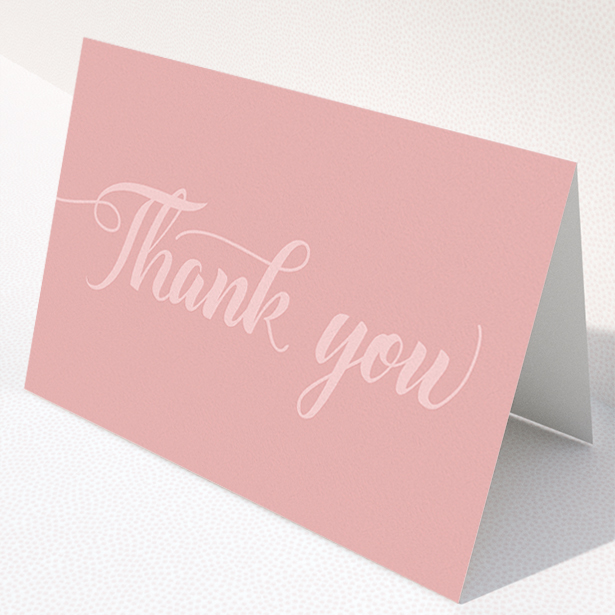 A wedding thank you card design called "Pastel pink calligraphy". It is an A5 card in a landscape orientation. "Pastel pink calligraphy" is available as a folded card, with mainly pink colouring.