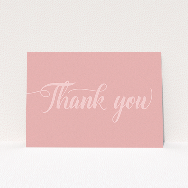 A wedding thank you card named "Pastel pink calligraphy". It is an A6 card in a landscape orientation. "Pastel pink calligraphy" is available as a flat card, with mainly pink colouring.