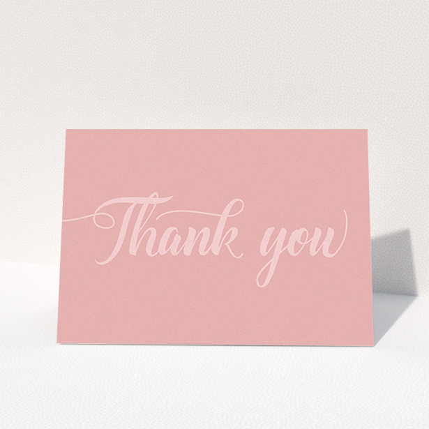 A wedding thank you card design titled "Pastel pink calligraphy". It is an A6 card in a landscape orientation. "Pastel pink calligraphy" is available as a folded card, with mainly pink colouring.
