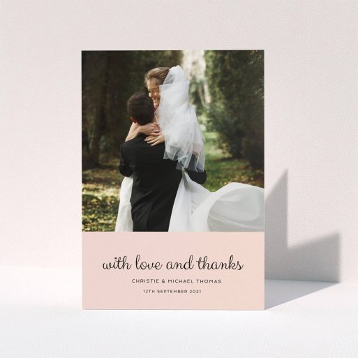 A wedding thank you card template titled "Pink Footer". It is an A5 card in a portrait orientation. It is a photographic wedding thank you card with room for 1 photo. "Pink Footer" is available as a folded card, with mainly pink colouring.