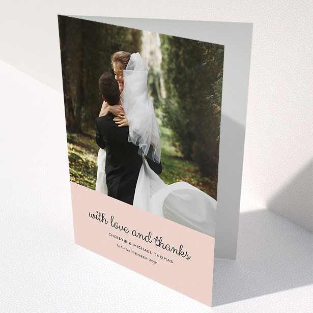 A wedding thank you card template titled "Pink Footer". It is an A5 card in a portrait orientation. It is a photographic wedding thank you card with room for 1 photo. "Pink Footer" is available as a folded card, with mainly pink colouring.