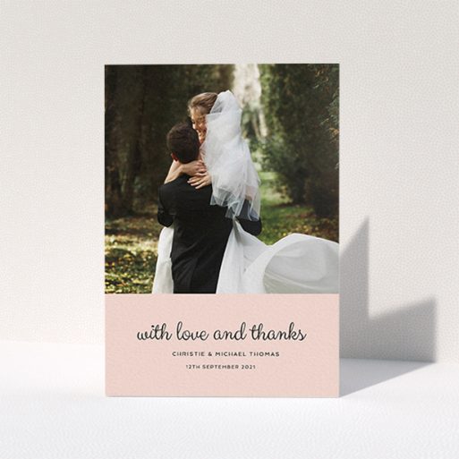 A wedding thank you card design named "Pink Footer". It is an A6 card in a portrait orientation. It is a photographic wedding thank you card with room for 1 photo. "Pink Footer" is available as a folded card, with mainly pink colouring.