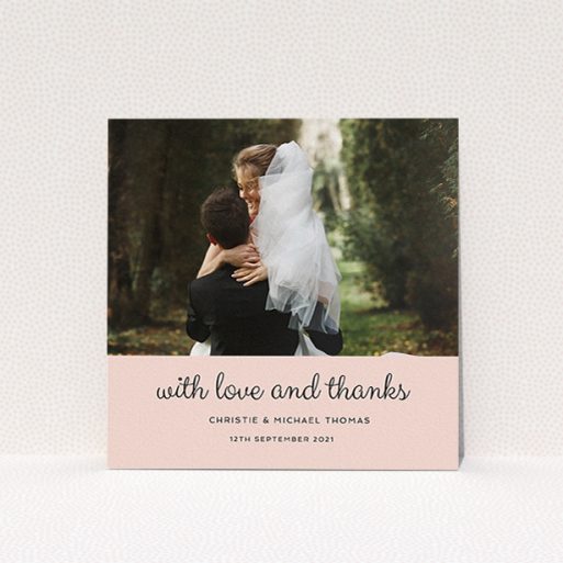 A wedding thank you card design titled "Pink Footer". It is a square (148mm x 148mm) card in a square orientation. It is a photographic wedding thank you card with room for 1 photo. "Pink Footer" is available as a flat card, with mainly pink colouring.