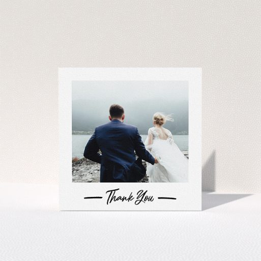 A wedding thank you card called "Portrait Thank You Photo". It is a square (148mm x 148mm) card in a square orientation. It is a photographic wedding thank you card with room for 1 photo. "Portrait Thank You Photo" is available as a folded card, with mainly white colouring.