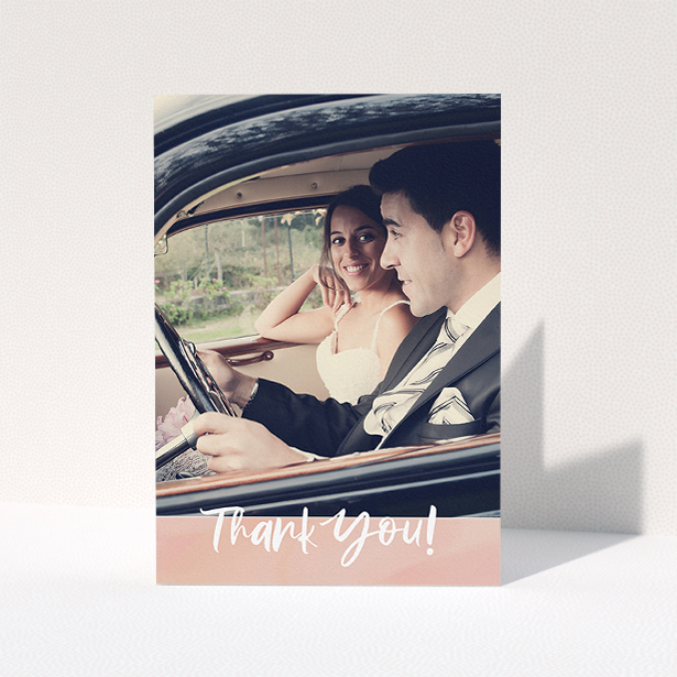 A wedding thank you card design called "Pretty on Pink". It is an A5 card in a portrait orientation. It is a photographic wedding thank you card with room for 1 photo. "Pretty on Pink" is available as a folded card, with tones of pink and white.