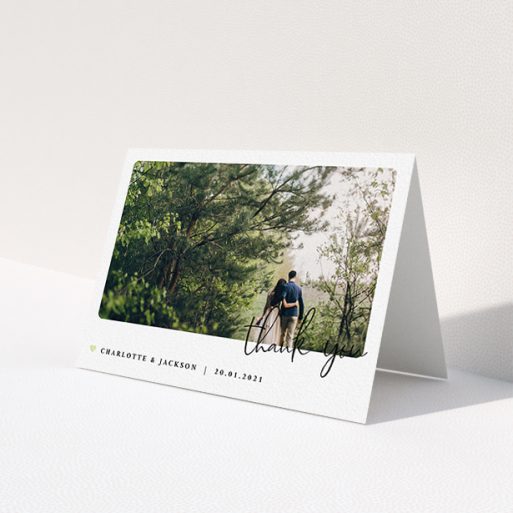 A wedding thank you card design called 'Rounded-Off with Thanks'. It is an A6 card in a landscape orientation. It is a photographic wedding thank you card with room for 1 photo. 'Rounded-Off with Thanks' is available as a folded card, with mainly white colouring.