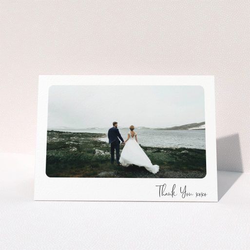 A wedding thank you card design called "Rounded Thanks". It is an A5 card in a landscape orientation. It is a photographic wedding thank you card with room for 1 photo. "Rounded Thanks" is available as a folded card, with mainly white colouring.